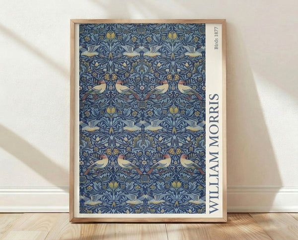 Art Nouveau botanical poster featuring intricately patterned birds and flowering plants in navy blue, gold, cream, and sage green tones.
