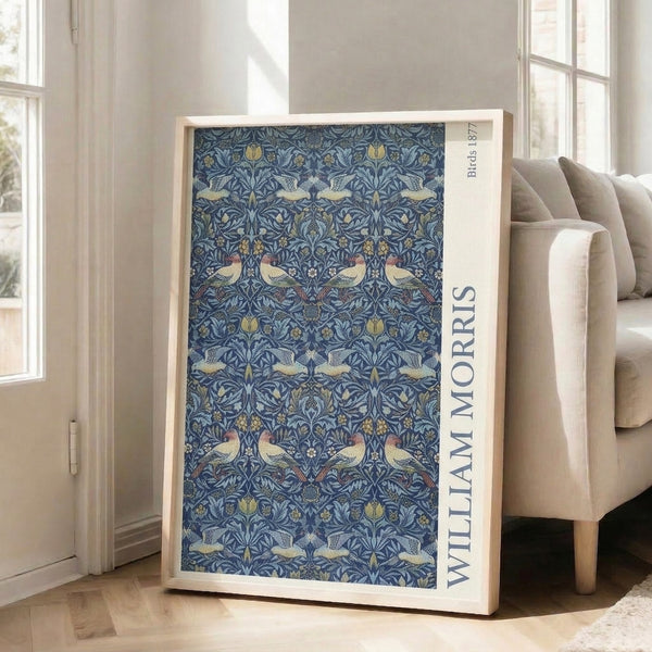 Decorative vintage print showcasing elegant birds amid flowing foliage in navy blue, sage green, gold, and terracotta hues.