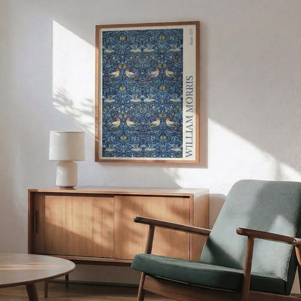 Ornamental wall poster displaying stylized birds among delicate botanical forms in navy blue, terracotta, cream, and sage green.