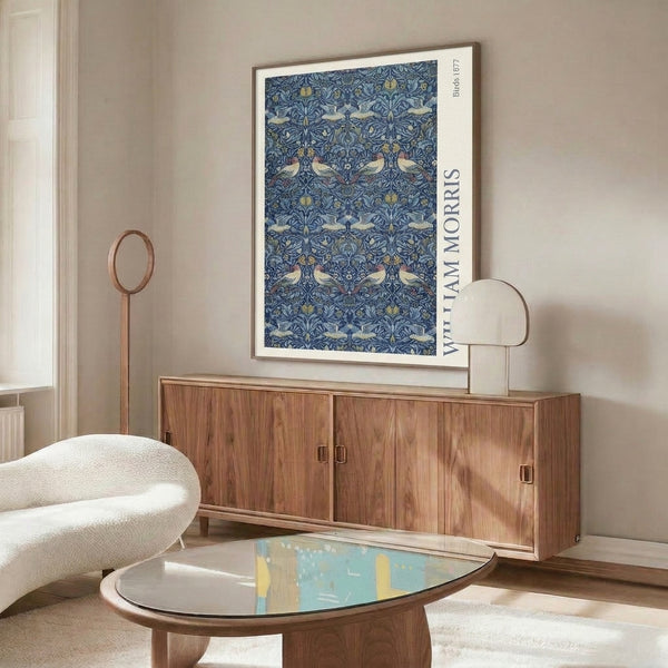 Vintage decorative art featuring ornate birds and botanical motifs in a classic late 19th century pattern of deep blue, cream, and earthy hues.