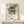 Elegant botanical wall art with densely patterned flowers and foliage in cream, green, and dusty blue hues, characteristic of vintage Art Nouveau design.
