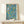 Framed Art Nouveau poster of stylized peaches, lemons, flowers and leafy branches in harmonious palette of muted blues, greens, yellows and warm coral tones.