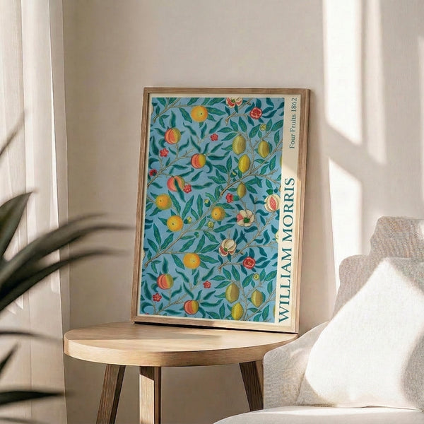 Vintage Art Nouveau botanical composition featuring peaches, lemons, branches and blooms with elegant leaf work in soft earth tone colors framed on wall.