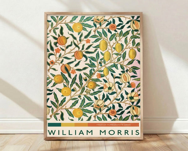 Art Nouveau botanical print featuring pomegranates, lemons, and flowering branches with ornamental leaves in forest green, golden yellow, and rust tones on cream background.