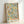 Ornamental Art Nouveau wall art showcasing pomegranate and citrus fruit with decorative foliage in sophisticated cream, green, and golden yellow palette.