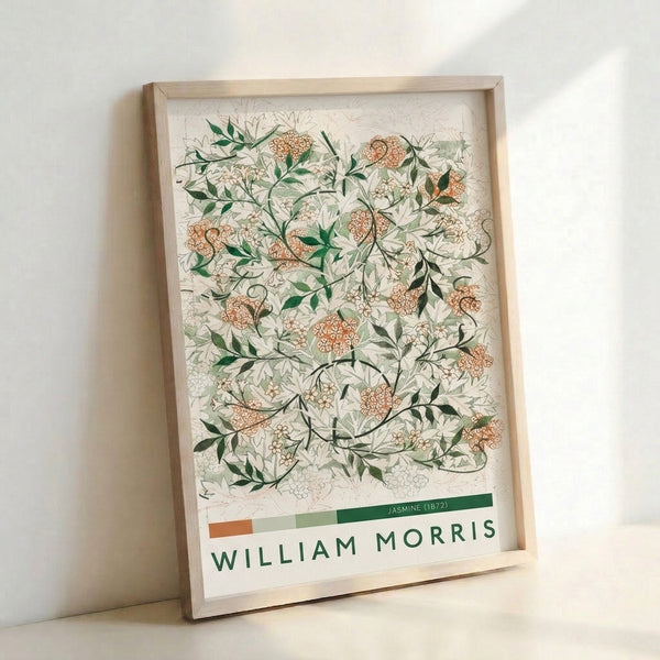 Decorative botanical artwork showcasing delicate jasmine blooms and naturalistic foliage in sage and forest green with warm tan accents, framed on wall.