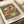 Elegant Art Nouveau wall print with intricate koi and botanical designs in a refined palette of navy blue, cream, orange, sage, and gold accents.