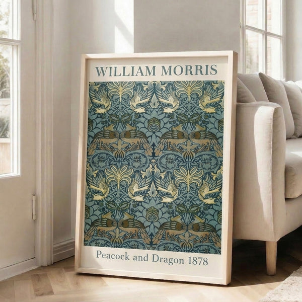 Ornate framed bird art print featuring an intertwined peacock and dragon amid flowering vines in rich teal and dark blue tones.