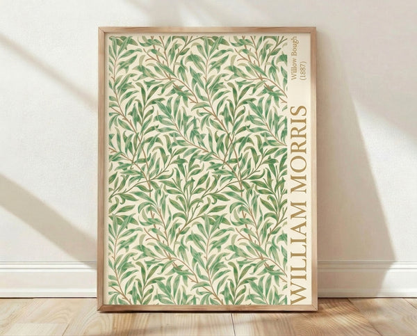 Art Nouveau poster featuring flowing willow branches and delicate leaves in sage green and olive tones on a cream background, framed on a wall.