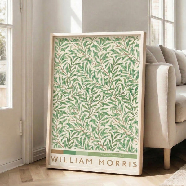 Vintage William Morris-inspired poster art displaying sweeping willow limbs adorned with leafy tendrils in sage, forest green, and warm tan hues on pale cream.