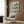 Wall art print displaying a casual wine bottle collection in linear minimalist style, with vintage color blocking in cream, green, navy, orange, and gold.