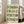 Convivial pop art framed print of wine bottles rendered as minimalist line illustrations with a warm, playful color palette of greens and warm tones.
