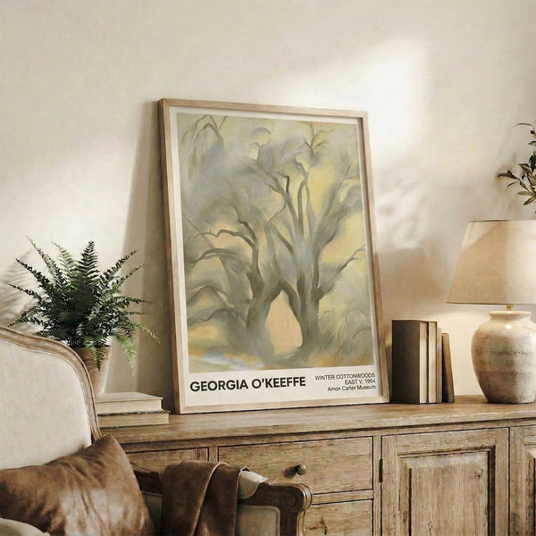 Delicate watercolor artwork of winter cottonwoods with intricate bare branches in soft cream, pale yellow, and warm gray, evoking contemplative stillness.