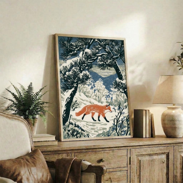 Vintage-inspired woodblock poster showing a solitary fox among winter pines beneath layered mountains, rendered in deep blue, black, rust, and cream tones with a contemplative, wintry mood.