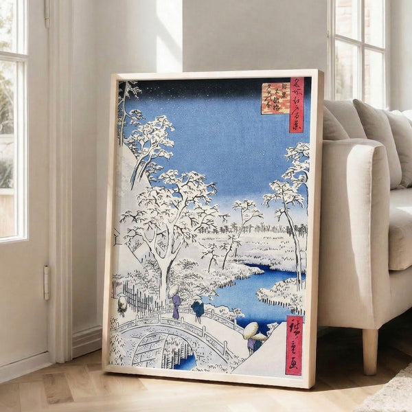Traditional Japandi-style winter print with delicate ink lines and cool palette: snow bridge, river landscape, pine trees, and distant peaks in cream and deep blue.