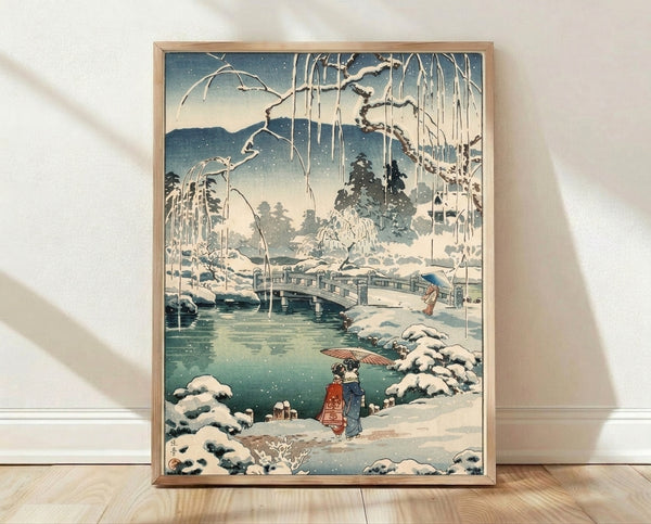 Serene Japanese woodblock print depicting a snow-covered bridge with willow trees and figures in winter clothing, rendered in deep teal, cream, and dark blue tones.