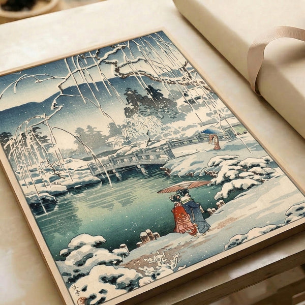 Ukiyo-e style framed art print depicting a tranquil winter scene with a wooden bridge, falling snow, distant mountains, and figures in traditional dress.