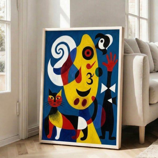 Framed surrealist print depicting a woman and dog gazing at an oversized moon, composed in soft blues, blacks, and pale tones.