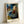 Vintage impressionist poster showing a woman at her bath in a shallow tub, painted in soft, delicate colors of blue, ochre, and cream.
