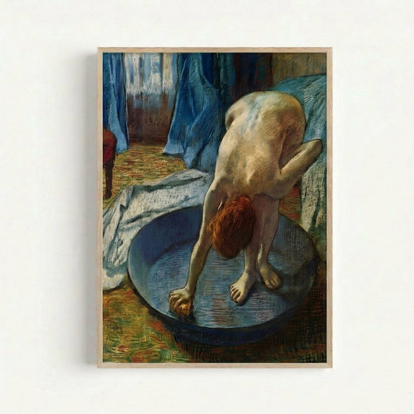 Vintage Degas-style framed art print showing a figure in a bathing scene with warm ochres and blues, evoking the intimate aesthetic of 19th-century impressionist art.
