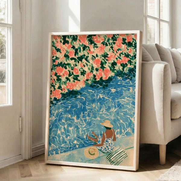 Vintage-style framed art print featuring a leisurely woman holding a parasol near poolside bougainvillea flowers in coral and pink tones, set against serene teal-blue water with sage-green and gold details.