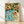 Modern minimalist framed poster of a woman relaxing by a swimming pool surrounded by coral and golden roses, rendered in soft teal, cream, and forest green tones.