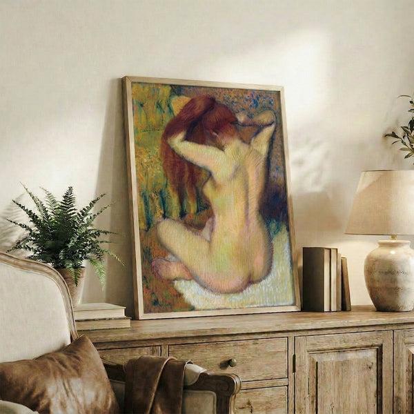 Poster art featuring a woman in profile combing her hair, executed in classical impressionist palette of muted golds and grays with ethereal quality.
