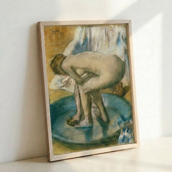 Quietly introspective watercolor scene of a woman in a tub, painted in warm and cool earth tones, shown as a framed poster in a modern interior.