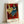 Matisse-style poster art depicting an introspective woman's face in soft blue hues with ochre accents and simplified abstract forms, hung as framed wall decor.