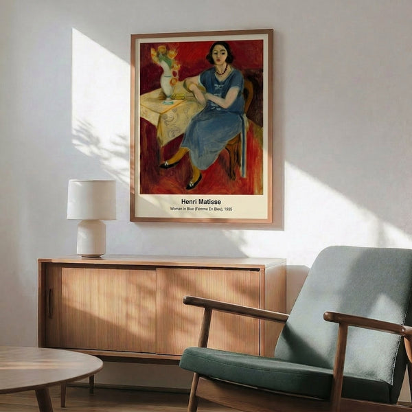 Framed abstract poster featuring a graceful female face rendered in cool blues and earthy ochres with bold linear details, embodying serene Matisse-inspired modernism.