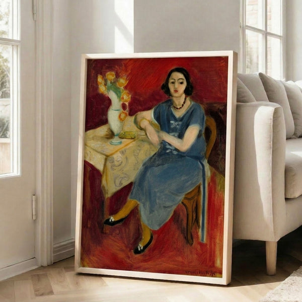 Contemporary framed art print featuring seated figure in harmonious blue tones with abstract, decorative aesthetic.