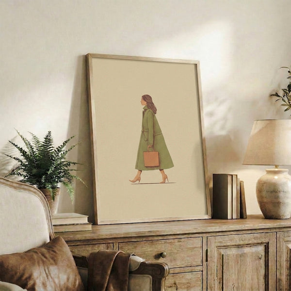 Modern minimalist poster art of an elegant woman in a sage green coat and accessorized with a handbag, featuring refined line art in muted natural colors.