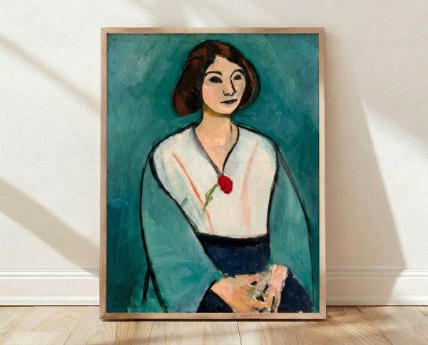 Framed Matisse portrait print of a woman with bold green face and vibrant simplified features, modernist style wall art.