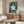 Framed poster featuring a woman's face rendered in vibrant green tones with Matisse's distinctive expressive style.