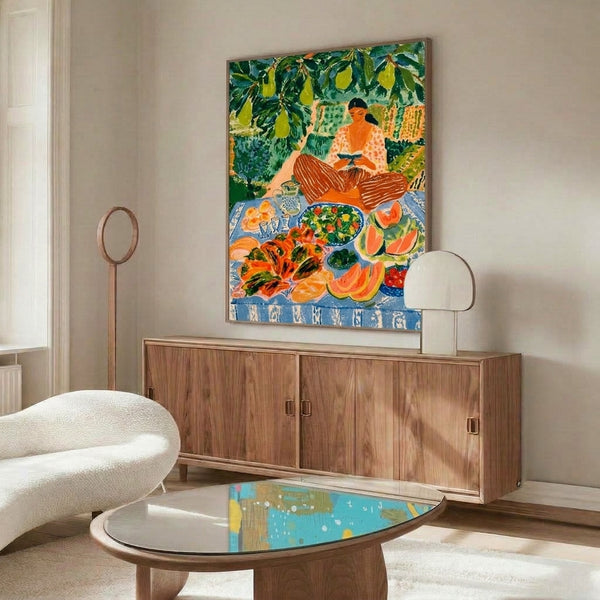 Serene Art Nouveau wall art featuring a reading woman in a summery pear orchard picnic scene with pitcher, fresh produce, and verdant garden palette in warm oranges and forest greens.