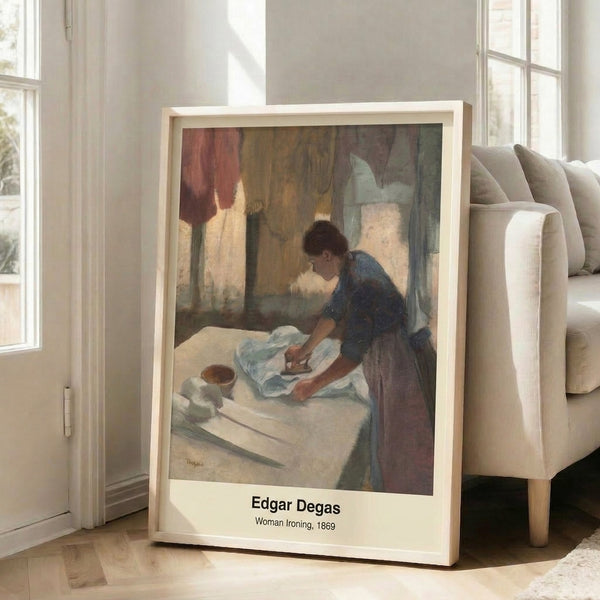 Contemplative Impressionist artwork of a woman at her ironing board, featuring delicate brushwork in cream, brown, and soft muted tones, presented as a wall-mounted art print.