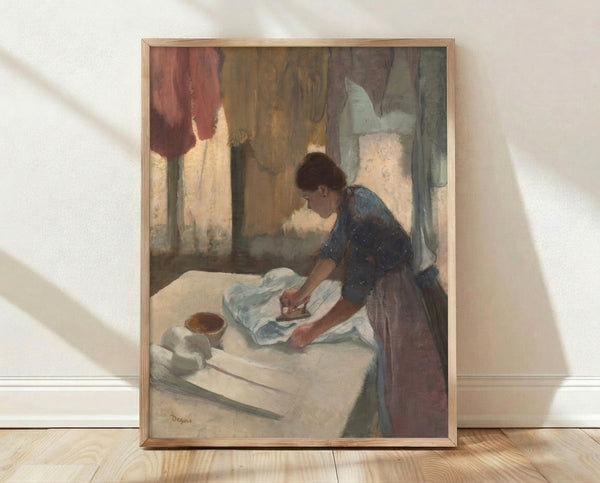 Impressionist painting of a woman bent over an ironing board, rendered in soft earth tones and muted colors, framed poster on wall.