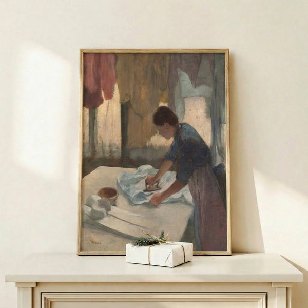 Intimate domestic scene of a woman ironing, painted in soft Impressionist palette with gentle, naturalistic brushwork, framed as wall art.