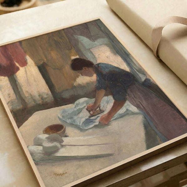 Quiet moment captured in Impressionist style: woman ironing, her form simplified and faceless, executed in soft ochres and grays, hanging as poster art.