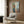Poster art displaying a figure examining herself in a mirror, rendered in the introspective style of Northern European modernism with organic, undulating forms.