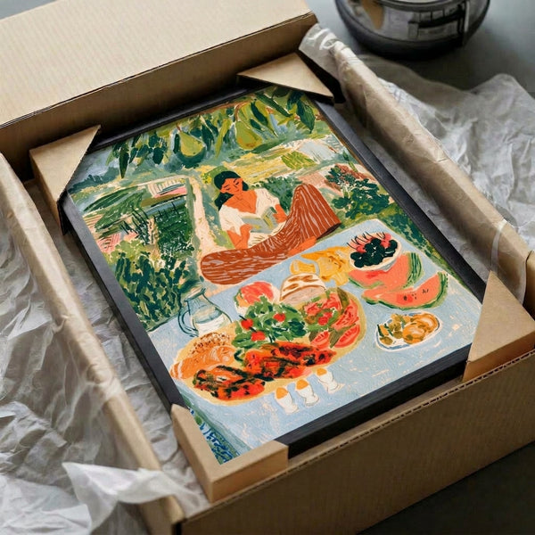 Contemporary art print with Bauhaus aesthetic capturing a tranquil moment: a woman lost in her book at a garden table laden with food, rendered in peaceful sage green, cream, and warm terracotta tones.