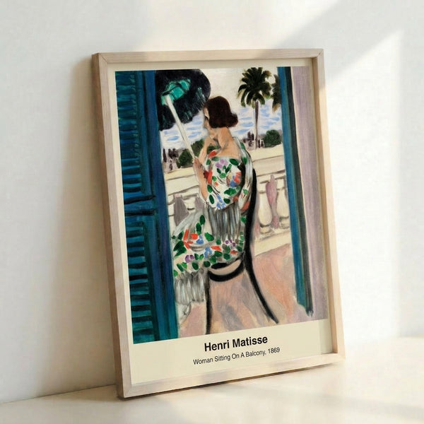 Minimalist framed artwork depicting a seated figure on a balcony, composed of bold color blocks in ochre, green, and blue with contemplative mood.
