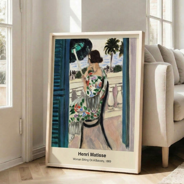 Abstract wall art showing a woman in a contemplative pose on a balcony, using bold geometric forms and a palette of ochre, blue, green, and white.