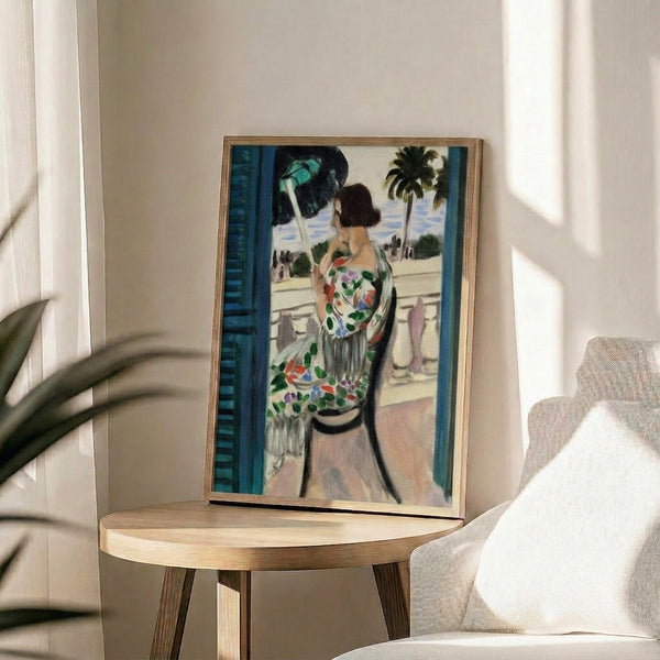 Modern minimalist print of a contemplative woman on a balcony rendered in striking ochre, blue, and green with abstract, expressive forms.