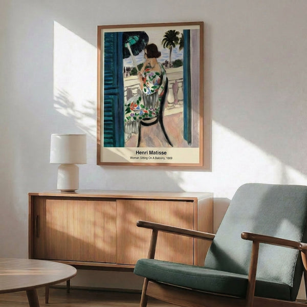 Abstract artwork featuring a woman sitting on a balcony in a bold minimalist style, palette of ochre, blue, green, and black evoking contemplative emotion.
