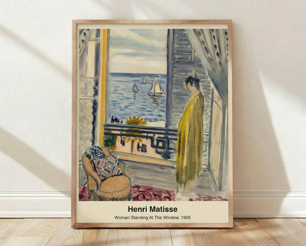 Framed modernist poster of a woman gazing through an open window, rendered in vibrant cobalt blue, warm yellows, and coral tones with luminous Impressionist brushwork.