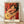 Abstract framed poster of a woman with a guitar in ochre, blue, and red tones, inspired by Matisse's playful modern style.