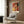 Matisse-style framed poster of a musician with guitar in bold abstract shapes and a warm ochre, red, and green palette.
