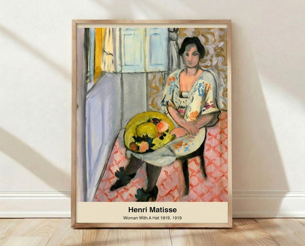 Abstract portrait of a woman wearing a hat, rendered in bold pink, blue, green, and yellow tones in Fauvist style; framed poster displaying expressive, modern art.