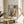 Abstract figure portrait of a woman wearing a hat in vibrant Fauvist palette of blues, yellows, oranges, and pinks; sophisticated modern wall art.